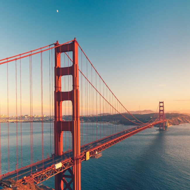 Angled view of Golden Gate Bridge on the start of sunset
